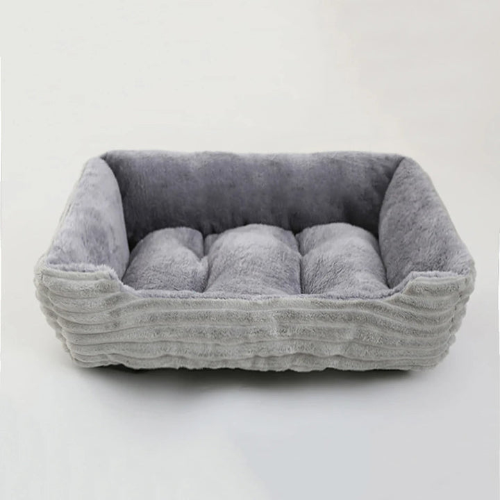 Cozy square calming dog bed, soft plush texture and a protective waterproof oxford fabric