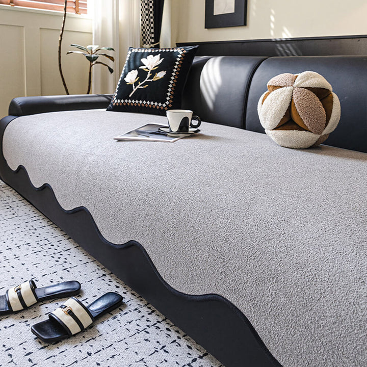 Teddy fleece couch cover protecting a sofa from spills, water-repellent feature visible