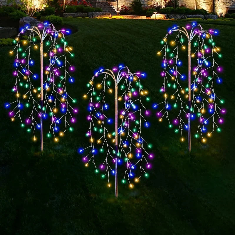 Three solar garden lights illuminating a pathway, perfect for outdoor decor and accent lighting.