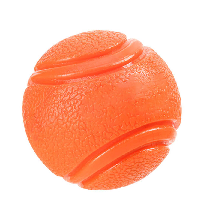 Detail of the robust rubber material of a squeaky floating dog toy ball for lasting fun
