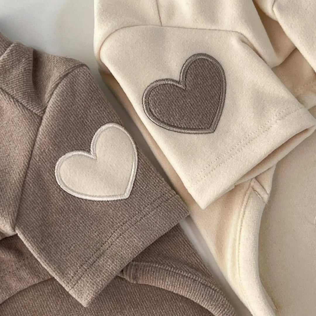 Close-up of soft polyester fleece texture on a unisex hooded sweatshirt, warm autumn wear