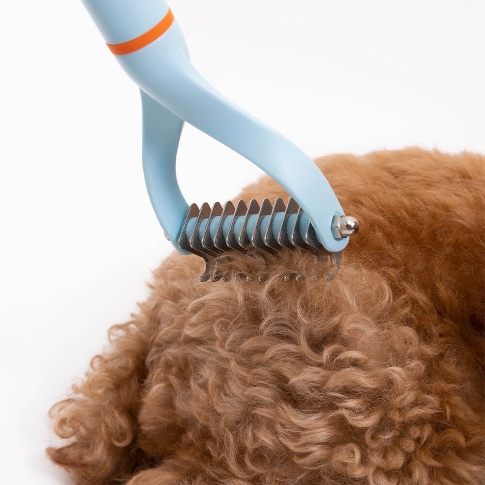Pet Dematting Comb with wide and narrow double-sided blades, an essential pet grooming supply for dogs and cats.