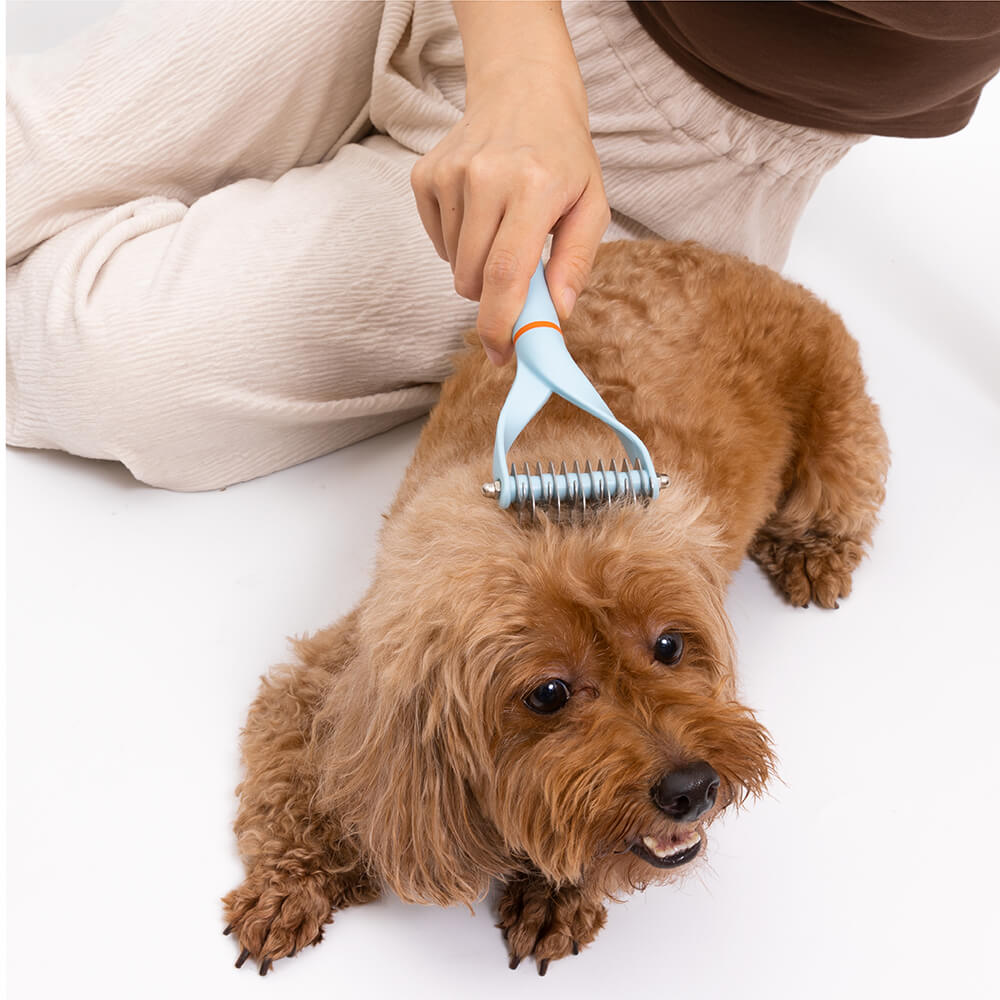 Pet Dematting Comb laid on a clean surface, emphasizing its readiness for dog and cat grooming.