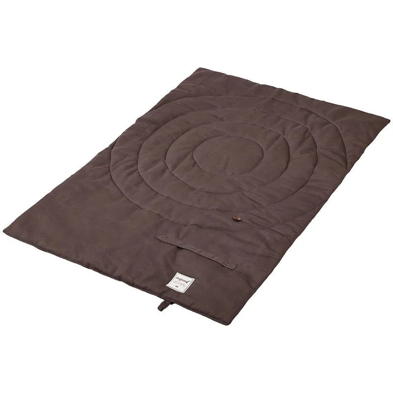 Multiple views of the foldable pet mat, showing its versatility as a dog bed, travel mat, and accessory.