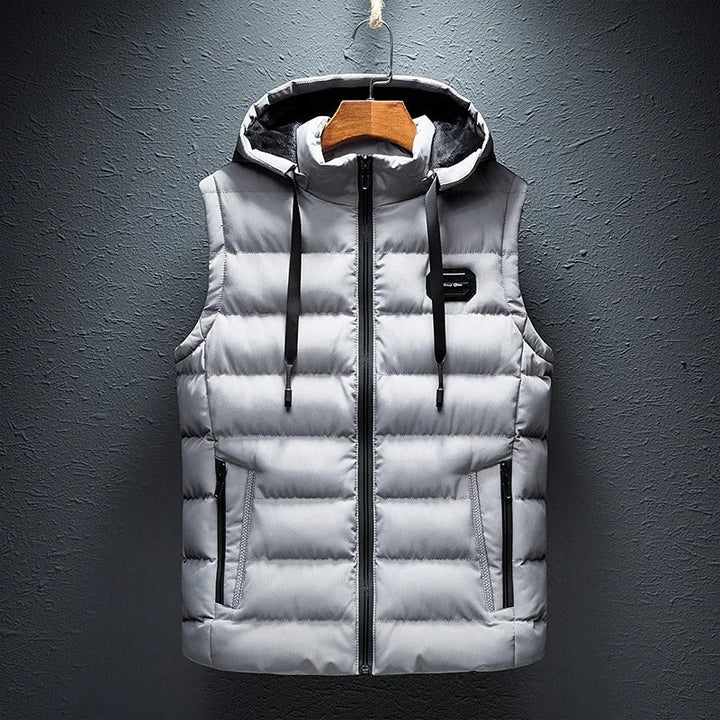 Warm men's insulated winter vest, perfect for alpine activities & cold weather layering, essential outdoor gear.