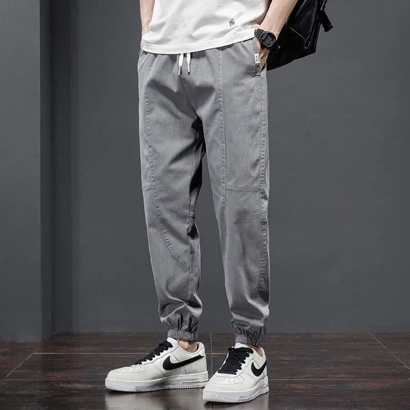 Man in tapered fit men's joggers, showcasing casual comfort, athletic style & everyday fashion.
