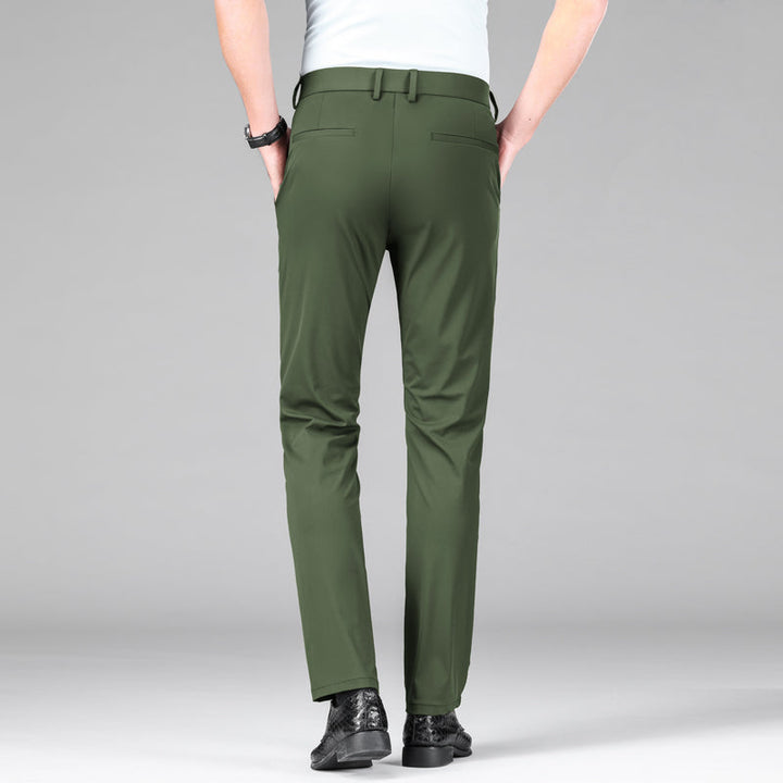Man wearing modern slim fit performance trousers, showcasing their smart casual look.