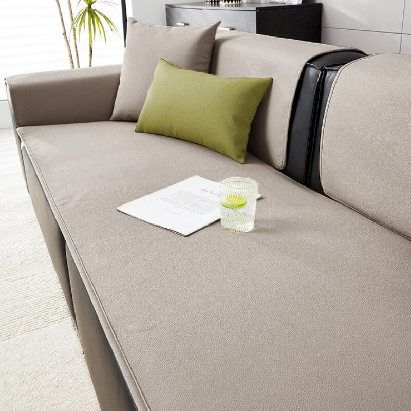 Side view of a sectional couch fitted with the pet-friendly furniture protection cover.