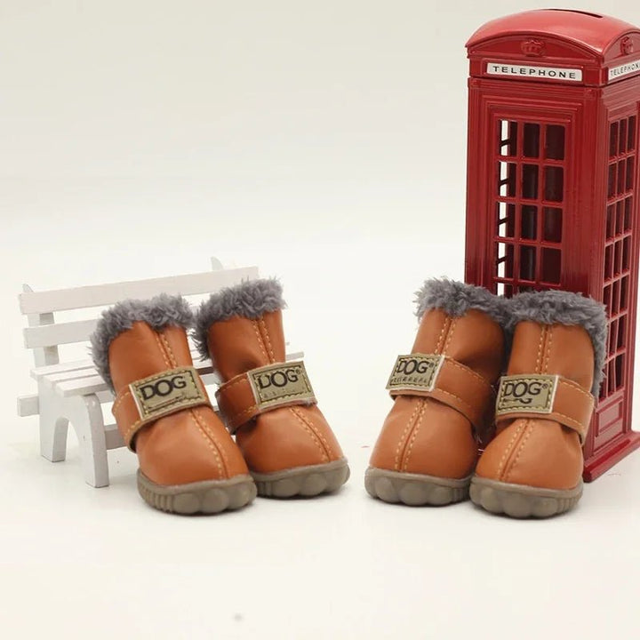 Waterproof dog boots with fleece lining for winter paw protection, suitable for small to large dogs.