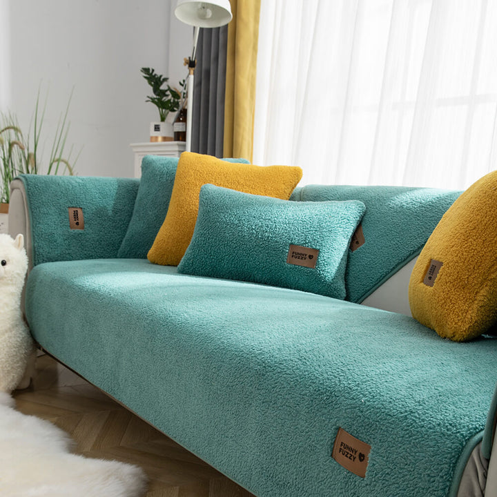Lifestyle image of a dog relaxing on a waterproof, non-slip sherpa fleece couch cover, pet-friendly design
