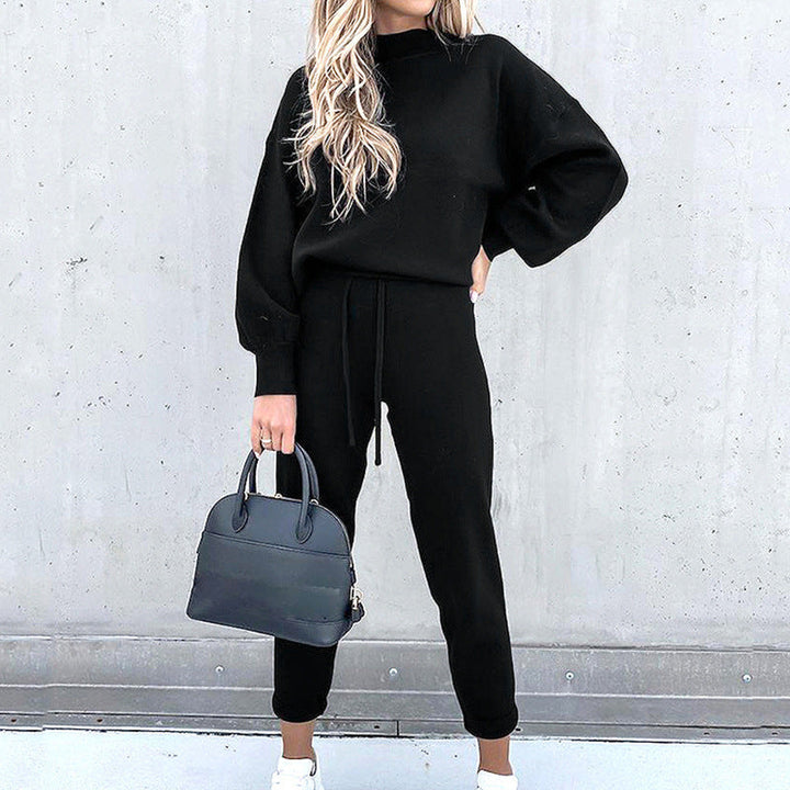 Woman smiling, wearing a stylish green plush loungewear set, perfect for casual cozy home wear.