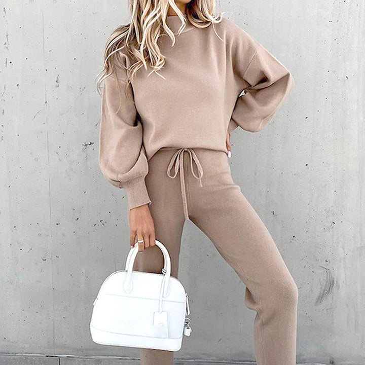 Stylish woman in a pink plush loungewear set, 2-piece outfit perfect for casual home wear & comfort.