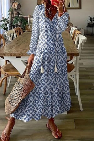 Vibrant floral print V-neck maxi dress with tassels, a comfortable and stylish bohemian summer dress for women.