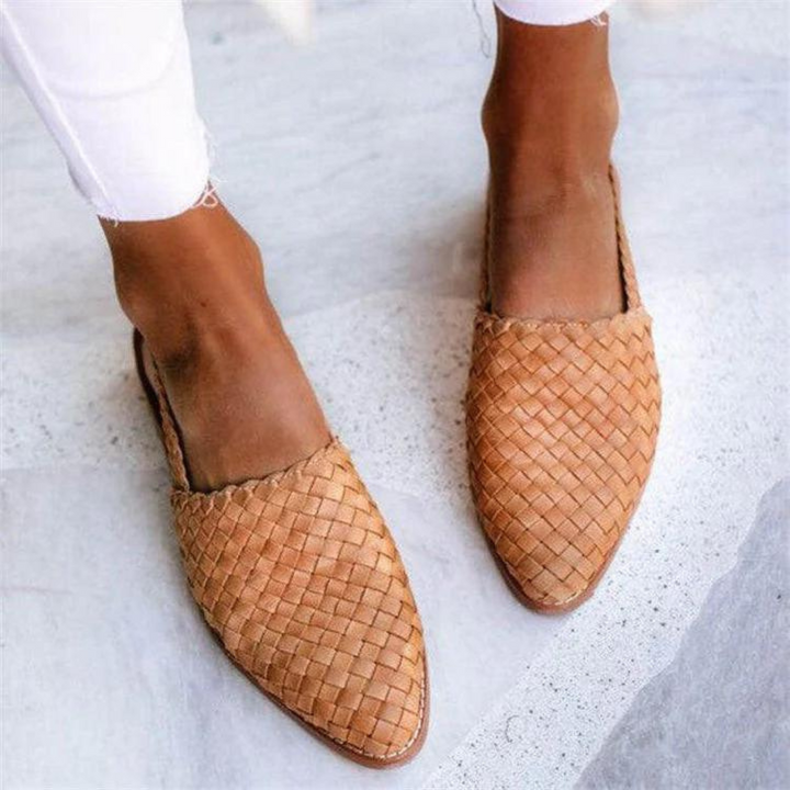 Chic women's woven pointed-toe slip-on mule loafers with flat heel, a comfortable and stylish spring shoe.