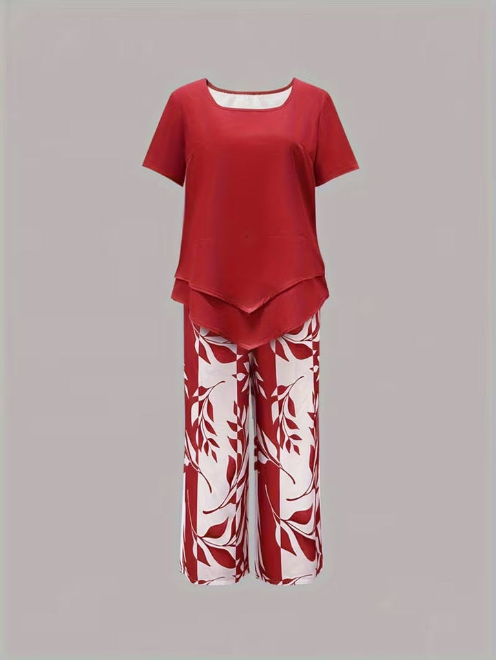 Women's short-sleeve leaf print top paired with matching high-waist cropped pants. Chic casual co-ord set.
