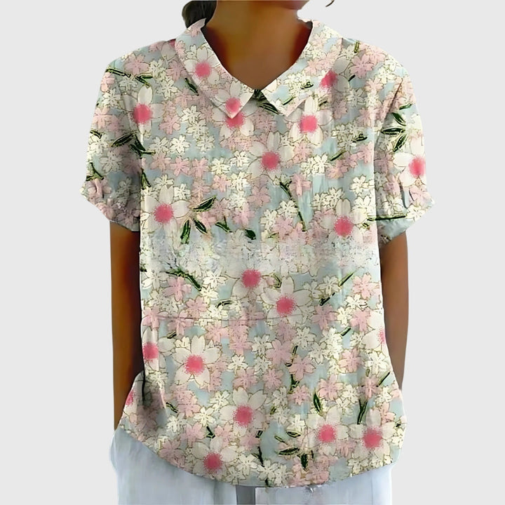 Model wearing a relaxed fit floral print blouse, showcasing its elegant and casual appeal.