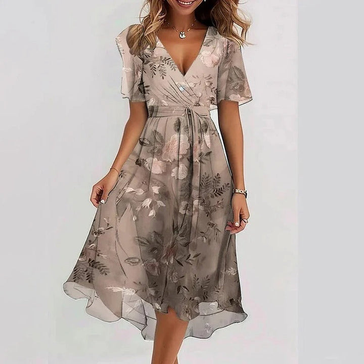 Vibrant floral print women's V-neck wrap midi dress with flutter sleeves for summer style & comfort.