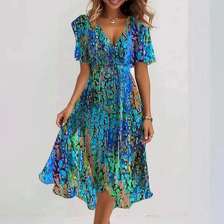 Women's elegant floral wrap V-neck midi dress with flutter sleeves & ruffle hem. Versatile summer party wear.