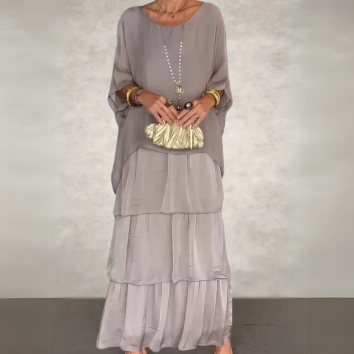 Stylish women's layered boho maxi dress set with a flowy batwing top, ideal for a chic summer outfit.