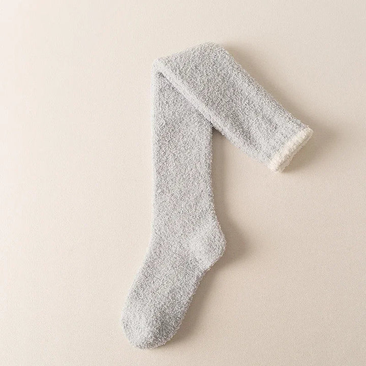 Warm winter fuzzy knee high socks for women. Cozy solid color loungewear, designed for ultimate comfort and softness.