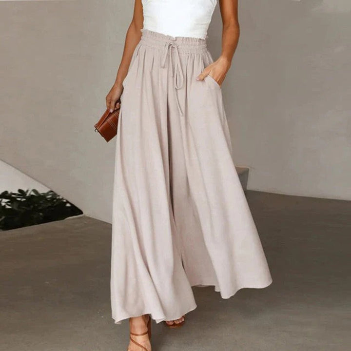 Stylish women's wide leg pants, high waist silhouette, with a functional drawstring and convenient side pockets.