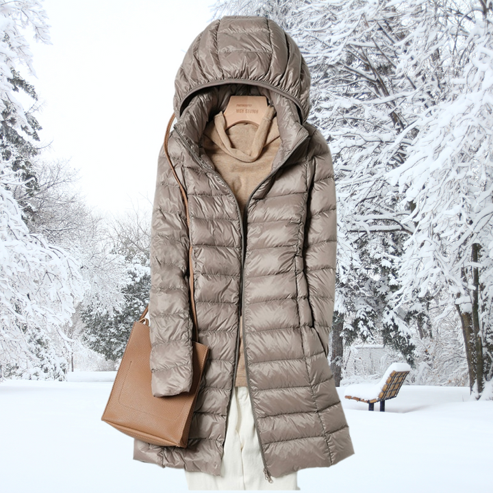 Packable women's insulated puffer jacket with hood. Ideal lightweight outerwear for travel & fall.