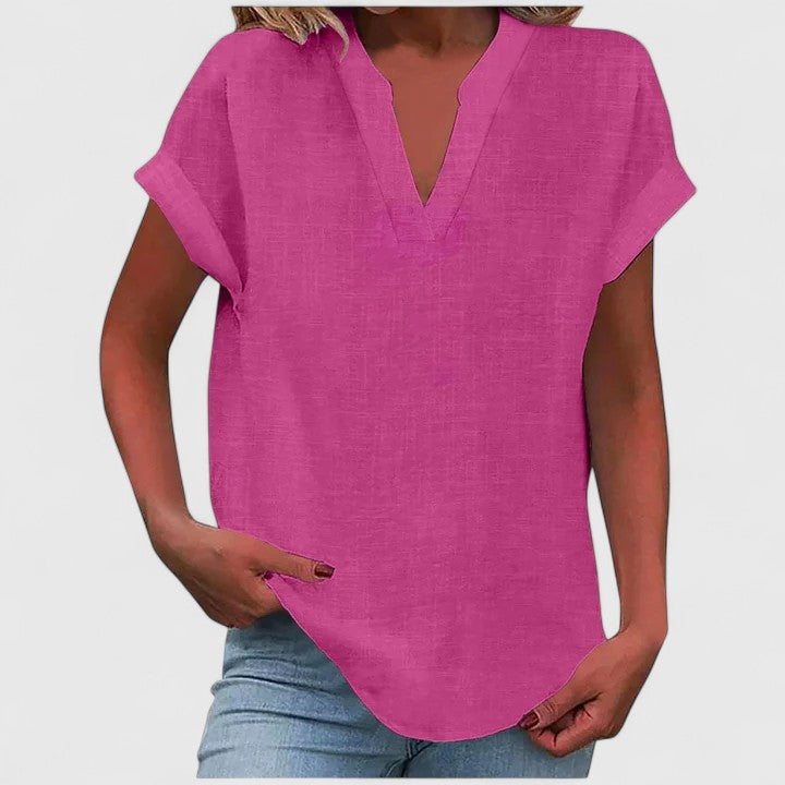 Comfortable women's blouse, V-neck, loose fit with cap sleeves & elegant curved hem.