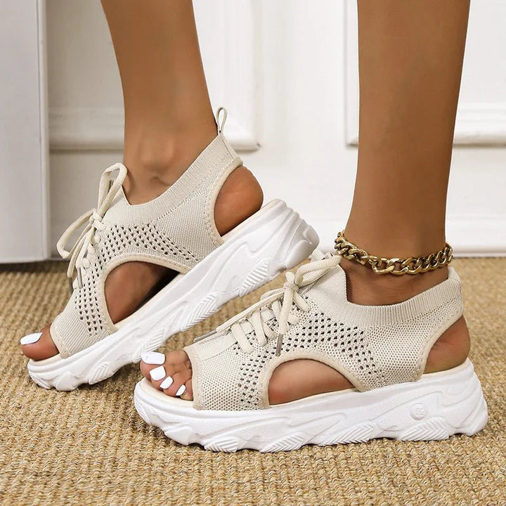 Elegant women's open-toe platform sandals with a secure, adjustable lace-up system. Great for summer.
