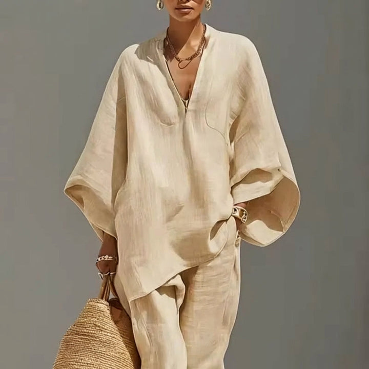 Women's relaxed fit tunic top & tapered pants two-piece set. Comfortable casual travel outfit.