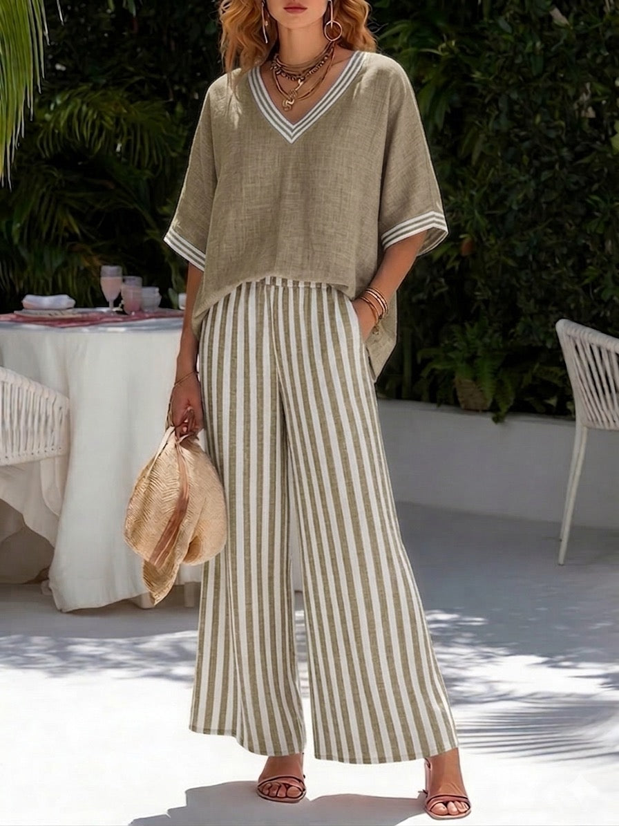 Chic women's striped V-neck top & wide leg pants two-piece set, perfect for casual, comfortable summer wear.