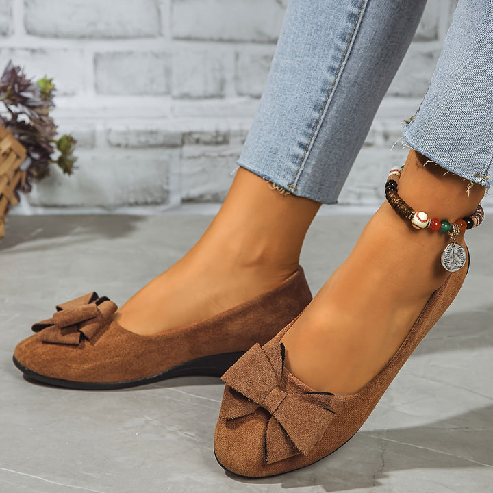Women's fashionable slip-on wedge heels, combining comfort with sophisticated style.