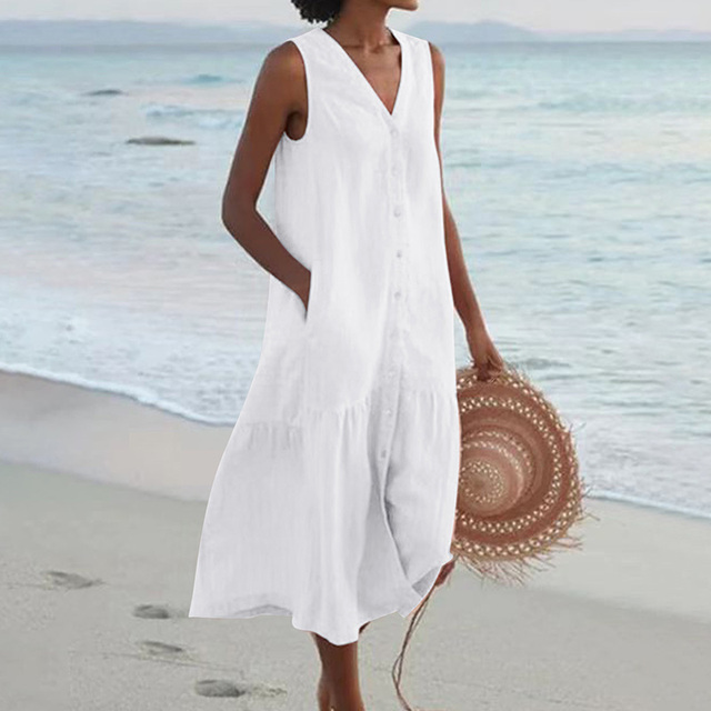 Woman in a stylish A-line sleeveless V-neck midi dress, ideal for warm weather, beach, or daily wear.