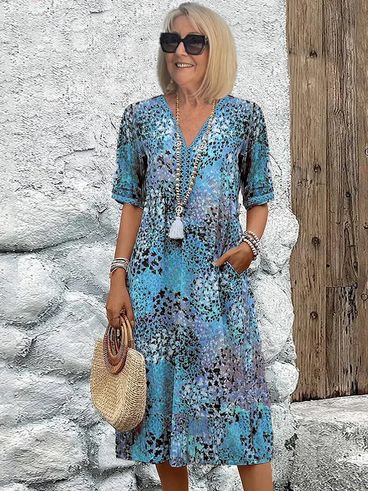 Comfortable women's midi dress with vibrant print & flowy design. Versatile for spring, summer, or parties.