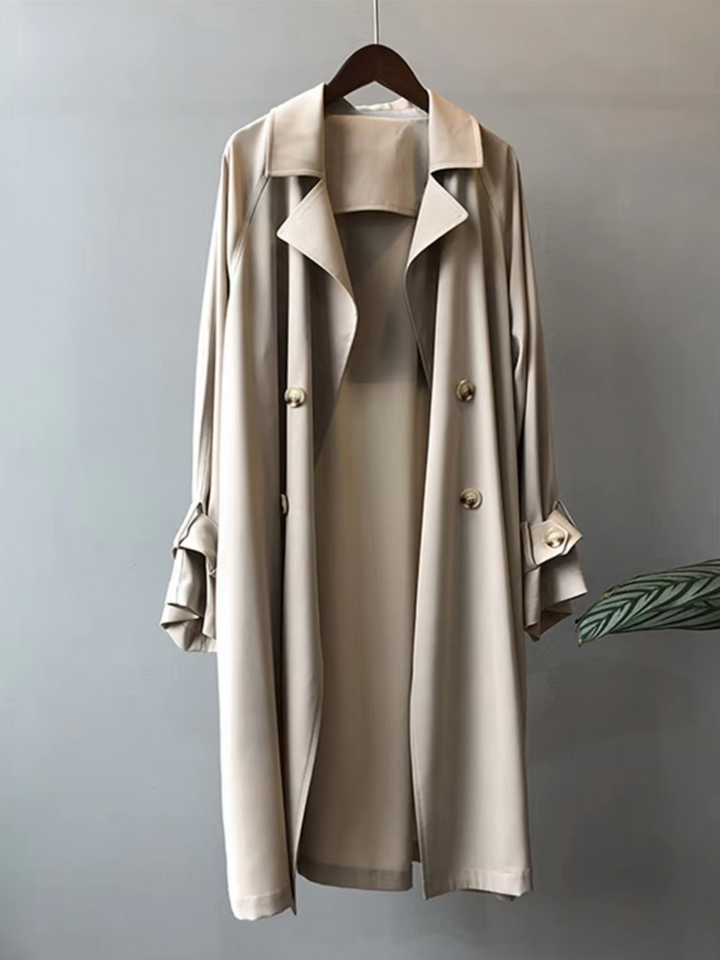 Versatile women's waterproof trench coat, ideal for business casual or elegant fall & spring rain protection.