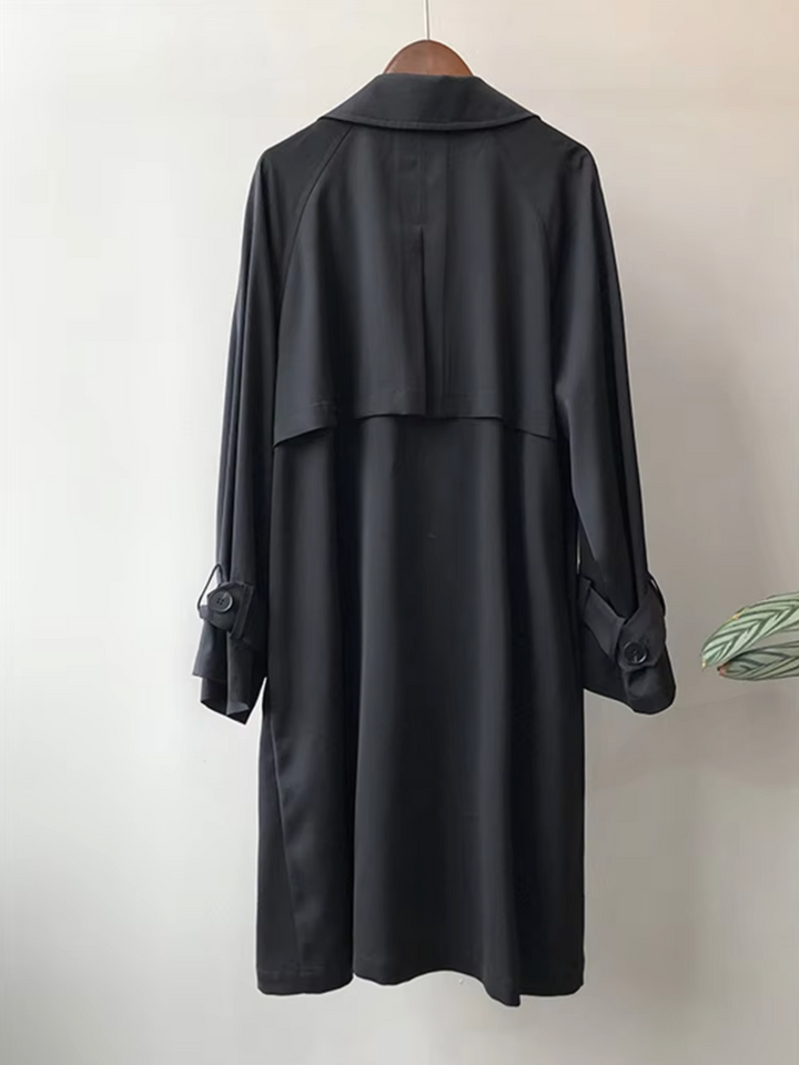 Classic women's double-breasted long trench coat with lapels, perfect waterproof outerwear for fall fashion.