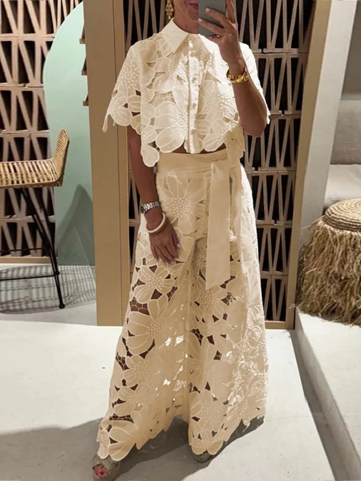 Elegant wide leg pants in floral lace, part of a women's two-piece matching set. Great for summer vacation.