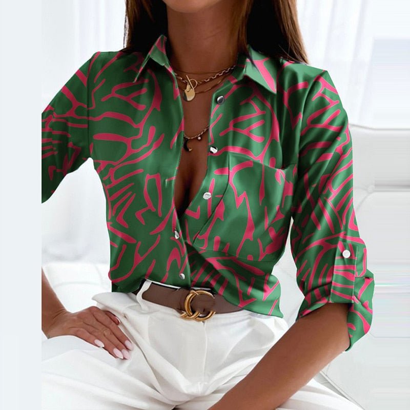 Comfortable women's long sleeve button-down blouse with a vibrant graphic print.