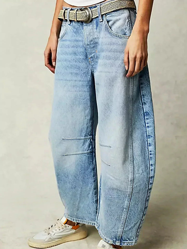 Front view of women's high-waisted wide-leg denim jeans, showcasing their flattering cut and modern style.